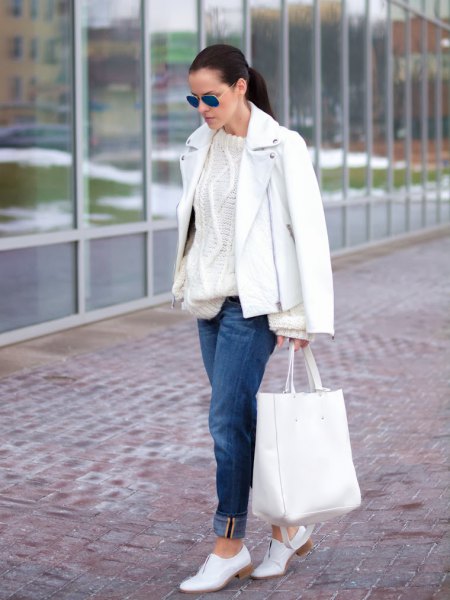 Leather jacket with a cable knit sweater and white shoes