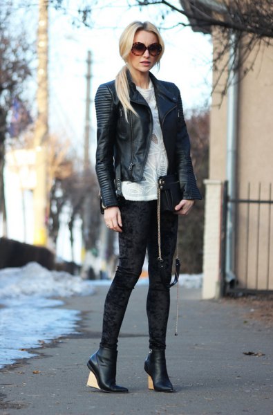 Leather riding jacket with an ivory-colored knitted sweater