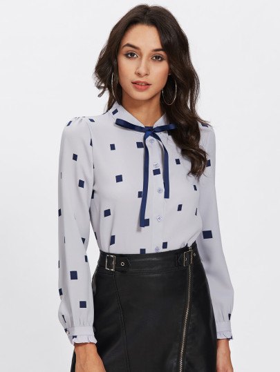 Light blue and dark blue printed leather skirt with tie neck blouse