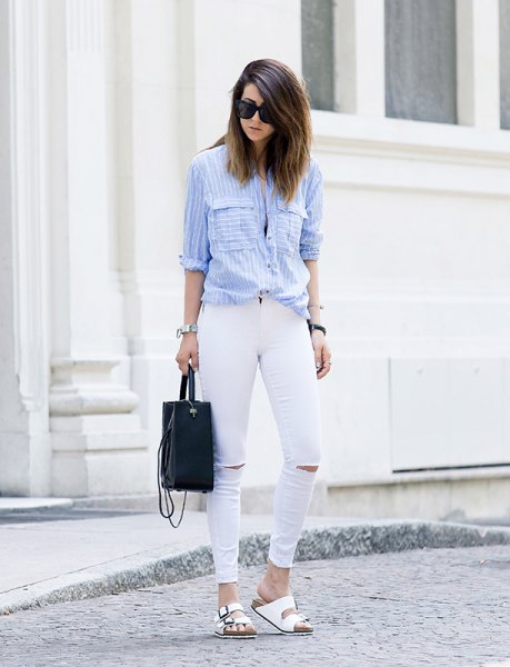 light blue and white striped shirt with buttons and ripped jeans