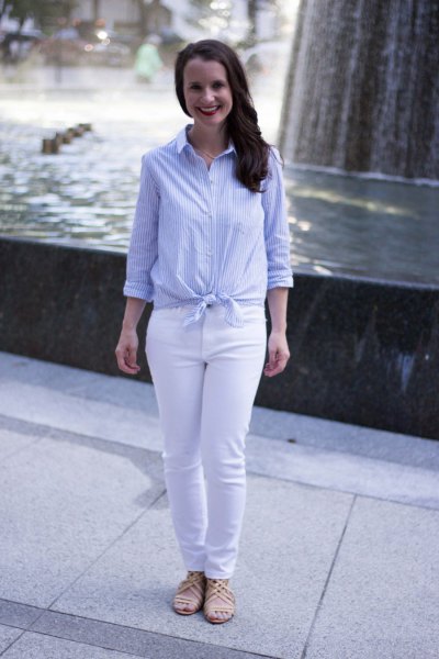 Light blue and white vertically striped knotted shirt with slim fit jeans