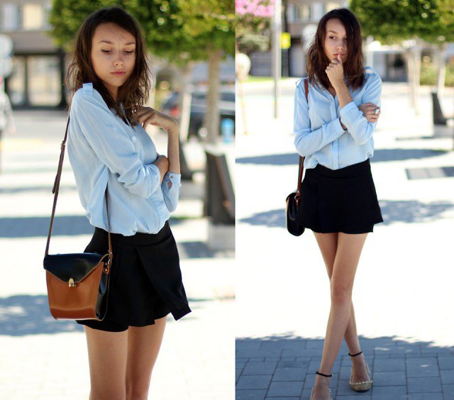 light blue chiffon blouse with button closure and black, flowing mini-shorts