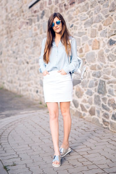 light blue shirt with button and white skirt