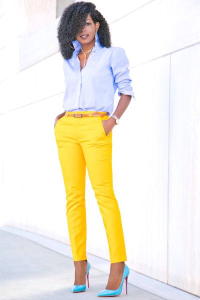 light blue shirt with buttons and yellow, narrow pants