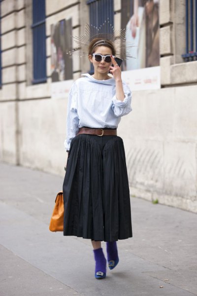 light blue blouse with waterfall neckline and black pleated maxi skirt