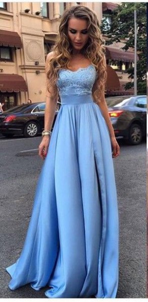 Light blue fit and a flared evening dress made of lace and silk
