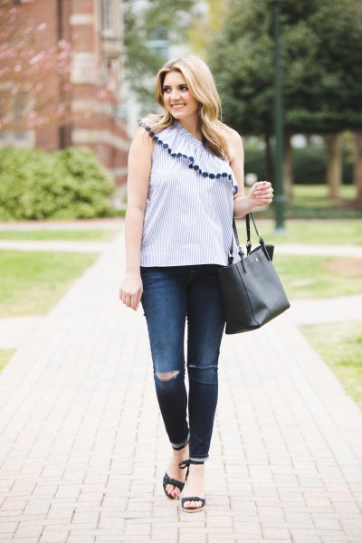 Light blue sleeveless top with a shoulder ruffle and skinny jeans