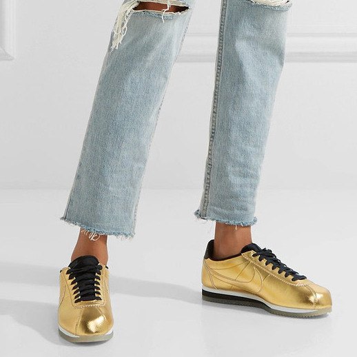 Light blue, torn tube pants with golden, comfortable hiking shoes