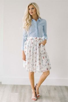 light blue shirt with white pleated skirt made of chiffon with floral pattern and pockets