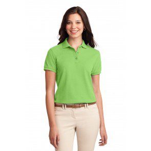 light green polo shirt with ivory-colored skinny jeans