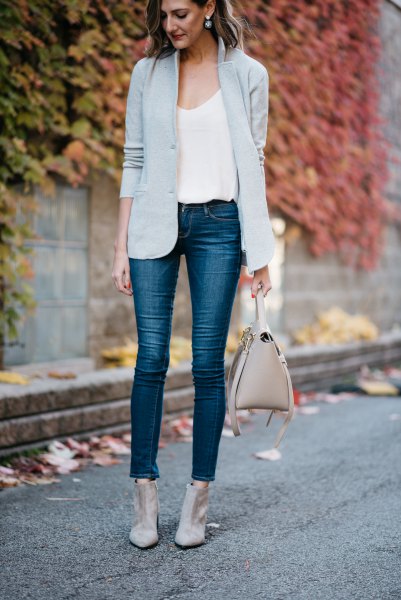 Light gray blazer with a white tank top with a scoop neckline and short jeans