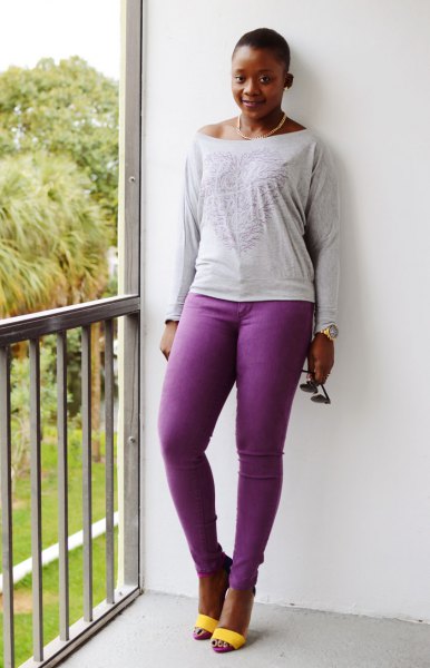 light gray long sleeve t-shirt with boat neckline and purple jeans
