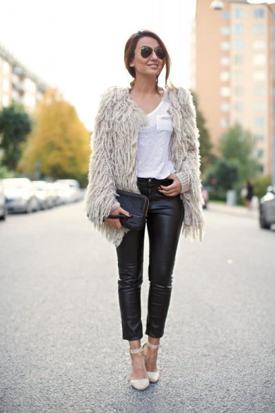 Light gray faux fur jacket with black, high-waisted leather gaiters