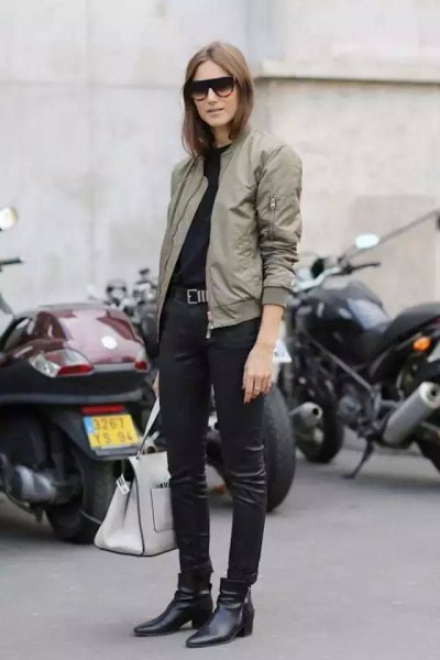 light gray flight jacket with black leather gaiters