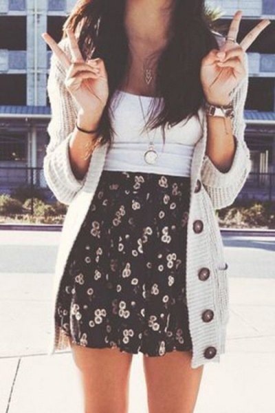 light gray longline cardigan with black and white printed minirater skirt