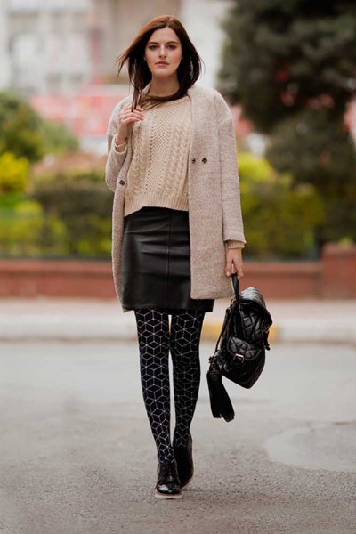 light gray longline cashmere cardigan with black mini leather skirt