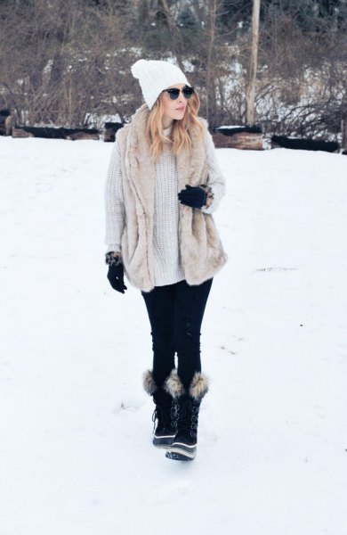 light gray, ribbed, chunky sweater dress with black faux fur snowshoes