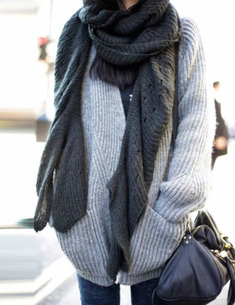 light gray ribbed chunky sweater with scarf that is worn as a scarf