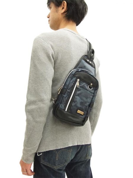 light gray ribbed sweater with a camouflage pouch
