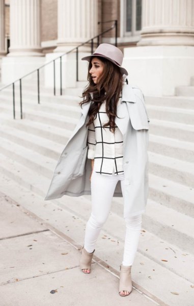 Light gray walker coat with a checked top and white jeans