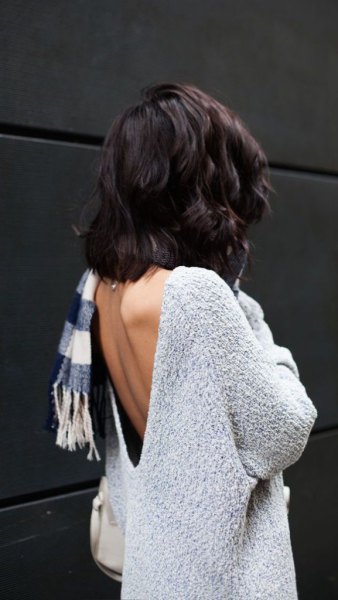 light mottled gray sweater with checked scarf