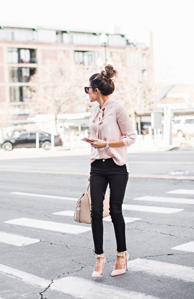light pink band blouse with black jeans and pointed toe heels