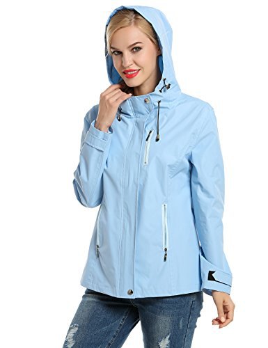 Light sky blue nylon sports jacket with hood and ripped jeans