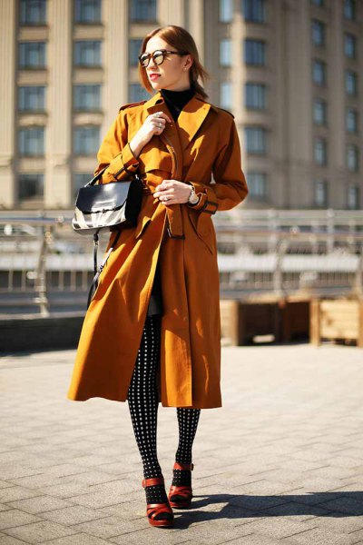 Lime green longline trench coat with black and white polka dot gaiters