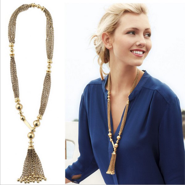 long gold chain in boho style with dark blue chiffon blouse