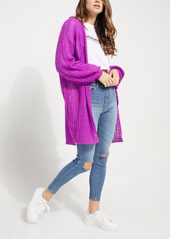 long, chunky, purple cardigan with ripped skinny jeans