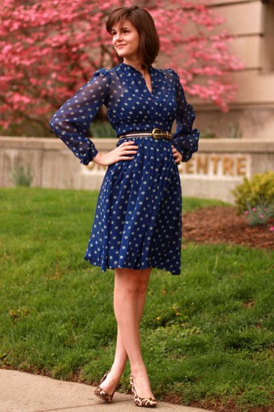 Long-sleeved, knee-length, blue polka dot dress with a chiffon belt and belt