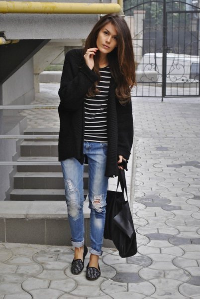 Longline cardigan with a striped T-shirt and black slippers with spikes