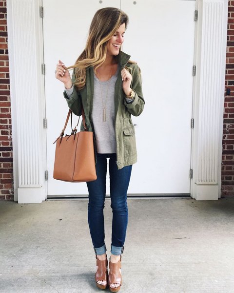 Olive-colored long-linen jacket with a gray tunic top and jeans with cuffs