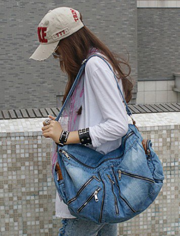beautiful blue denim travel bag with tunic shirt and washed, narrow-cut jeans