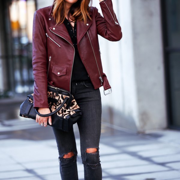 Maroon leather jacket with black skinny jeans