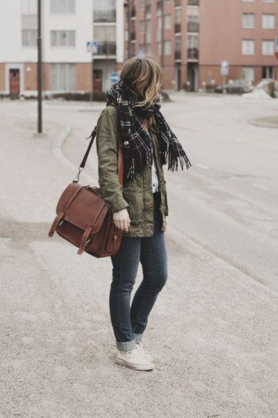 Military jacket with black plaid scarf and shoulder bag made of brown suede
