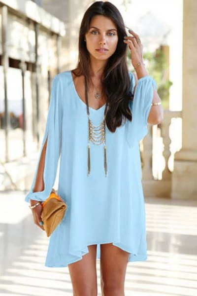 Mini light blue long sleeve dress with a boho statement necklace