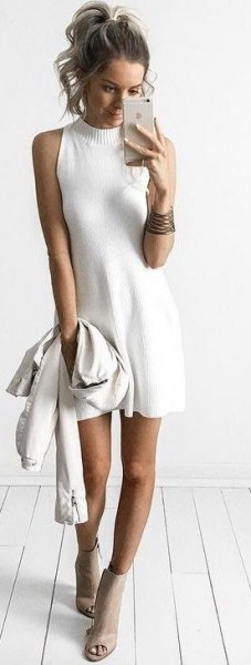 sleeveless, flared sweater dress with mock neck and open ankle boots