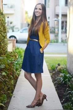 Mustard cropped cardigan with knee-length denim dress with belt