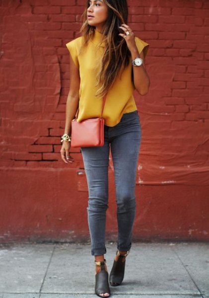 Sleeveless blouse with mustard mock neck and gray skinny jeans with cuffs