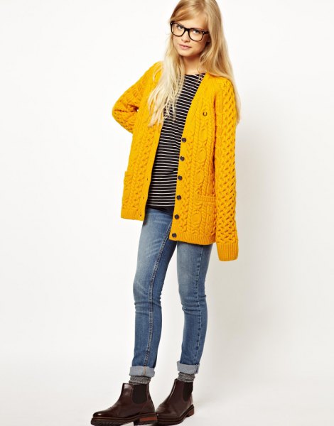 mustard-yellow cardigan with cuffed jeans and leather boots