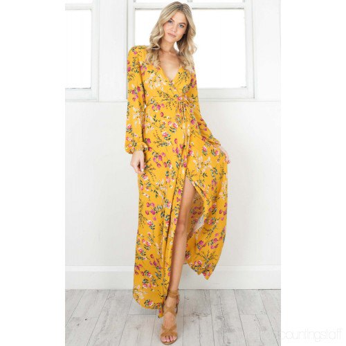 Mustard yellow, high split, long wrap dress with a floral pattern