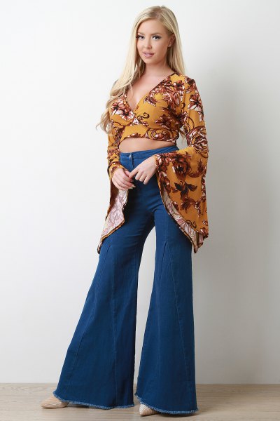 Mustard yellow printed, short cut blouse with bell sleeves and flared jeans