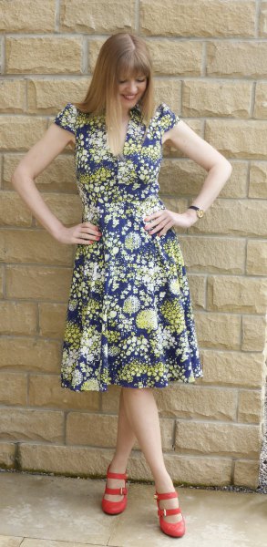 airy midi dress with floral pattern in navy and orange