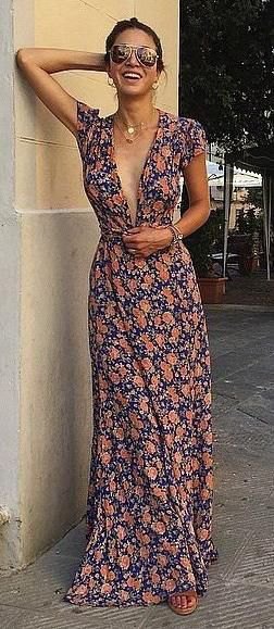 dark blue and pink floor-length dress with a deep V-neckline and floral pattern