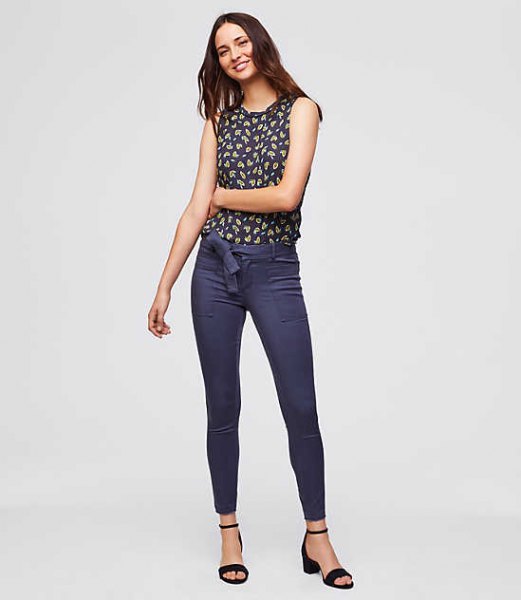 sleeveless blouse with navy and red print and blue chinos