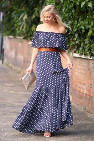 Dark blue and white polka dots on the maxi dress with shoulder girdle