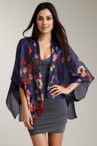 Dark blue chiffon cardigan with floral pattern and gray, figure-hugging dress with a scoop neckline