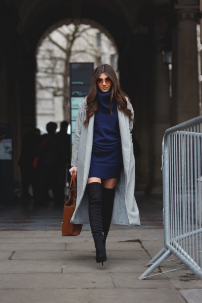 Dark blue knitted dress with a gray maxi blazer and overknee boots