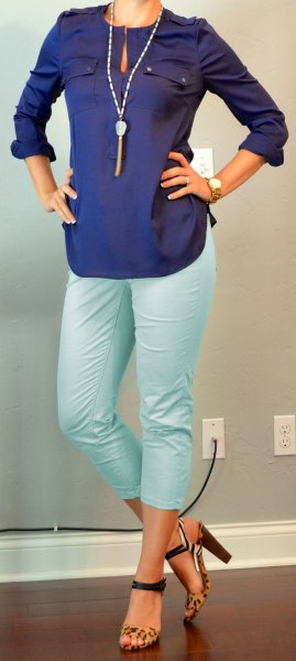 Dark blue long-sleeved keyhole blouse with white, shortened trousers